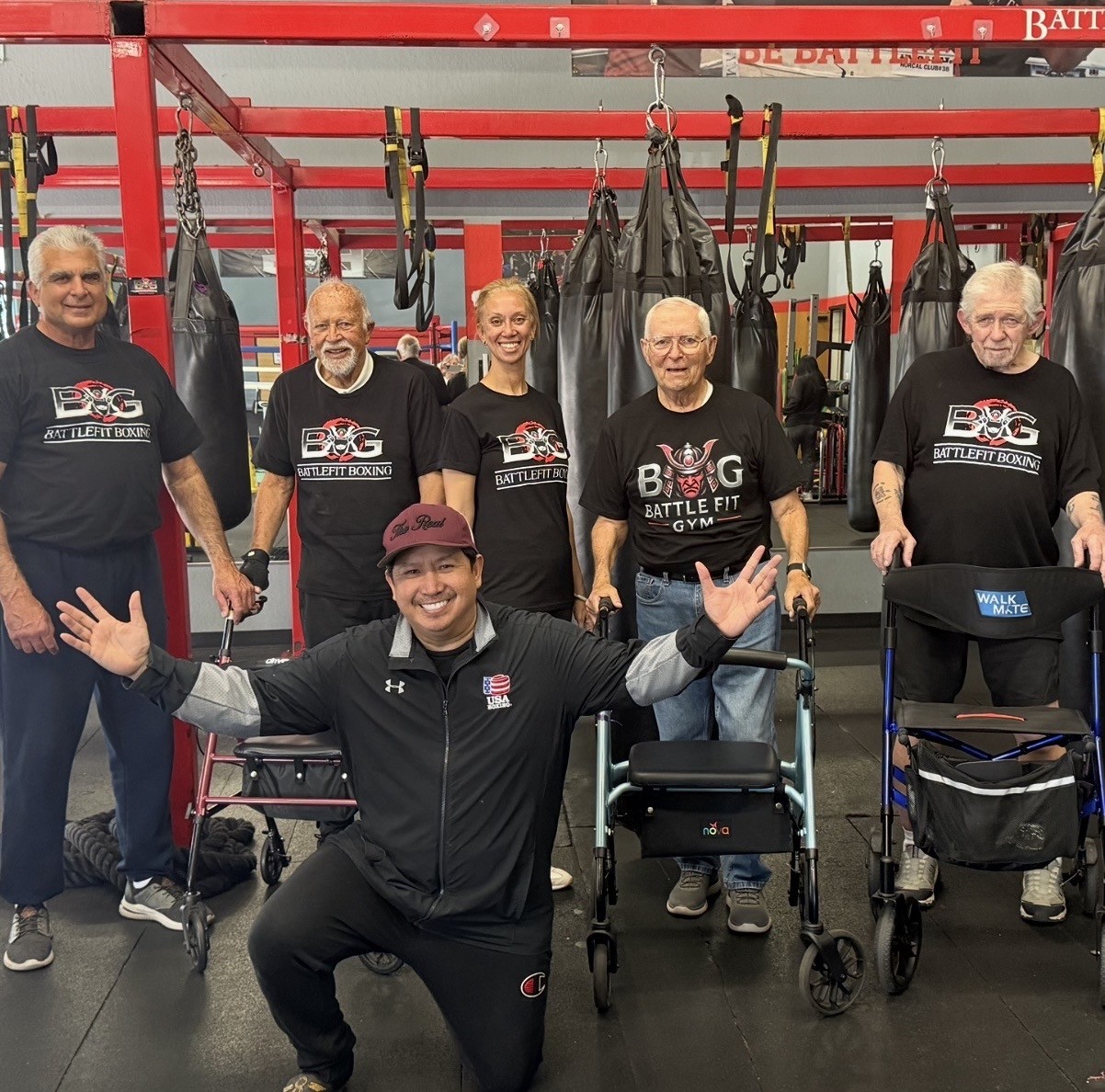 Coach Joseph and Platinum Fitness members at the gym